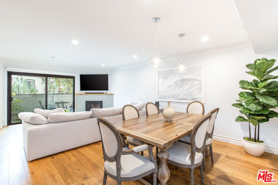 Dining room, Fireplace, Interior, Living room, Pendant Lights, Recessed Lighting, Wood Texture Flooring