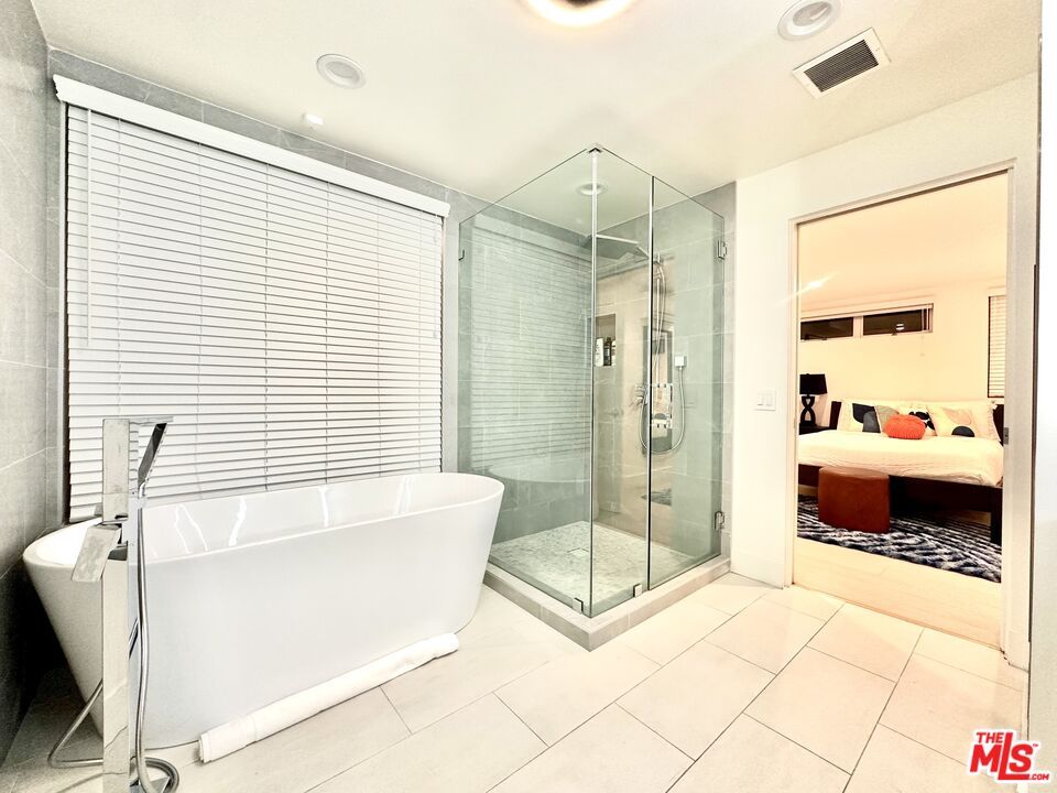 Bathroom, Free Standing Baths, Glass Shower, Interior, Recessed Lighting, Wood Texture Flooring