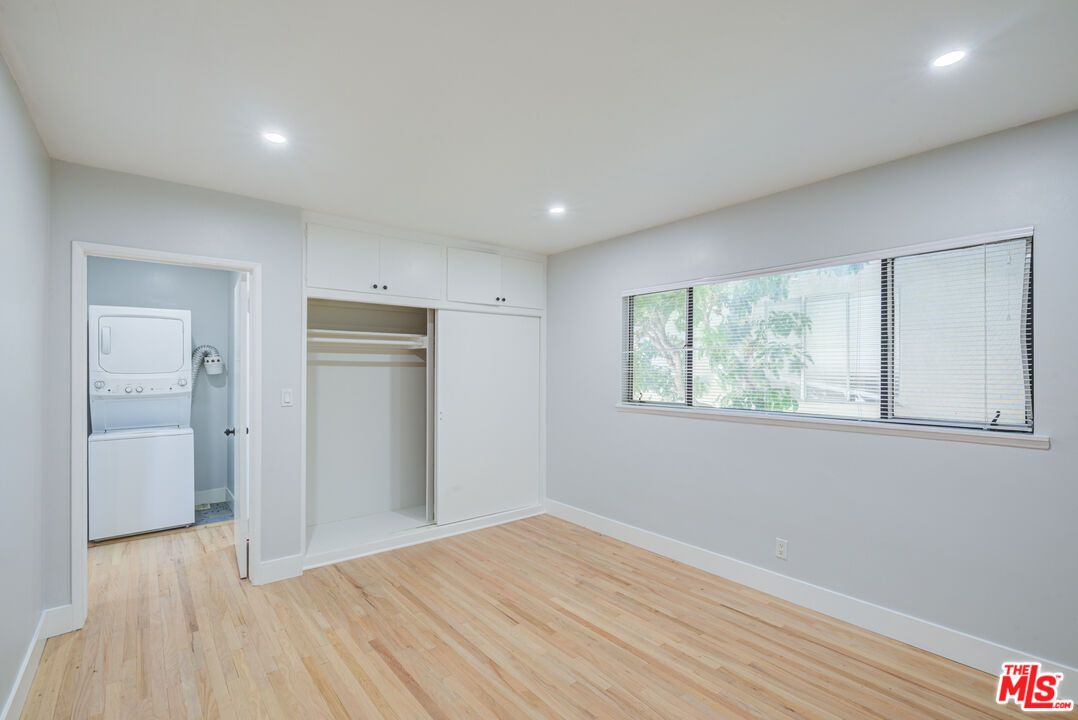 Empty room, Interior, Recessed Lighting, Utility Closets, Washer, Wood Texture Flooring