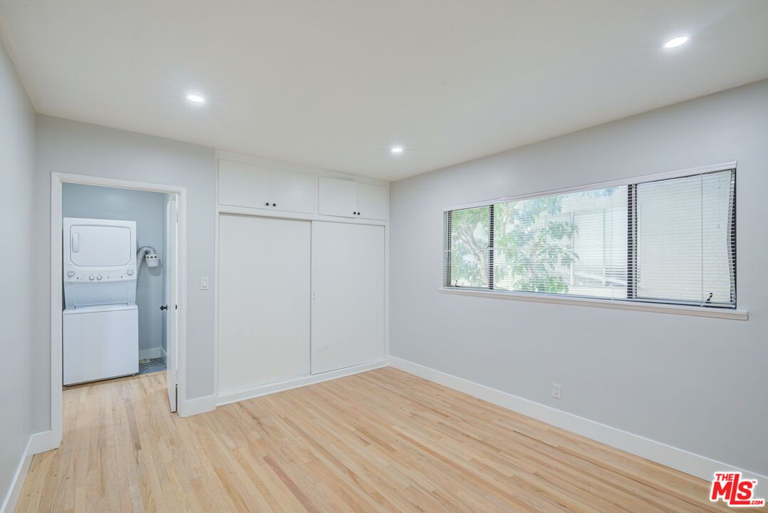 Empty room, Interior, Recessed Lighting, Utility Closets, Washer, Wood Texture Flooring