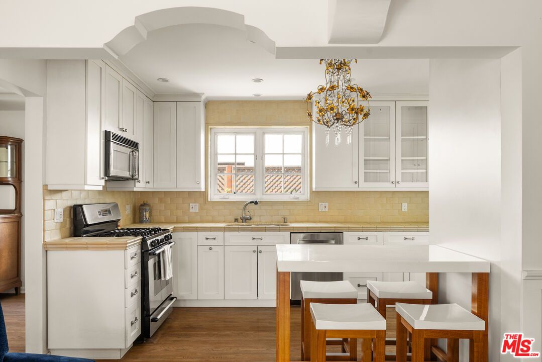 Chandelier, Interior, Kitchen, Recessed Lighting, Stainless Steel Appliances, Wood Texture Flooring