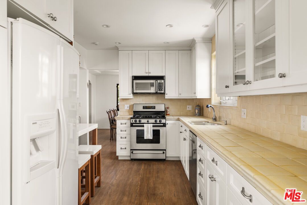 Interior, Kitchen, Recessed Lighting, Stainless Steel Appliances, Tile Countertops, Wood Texture Flooring