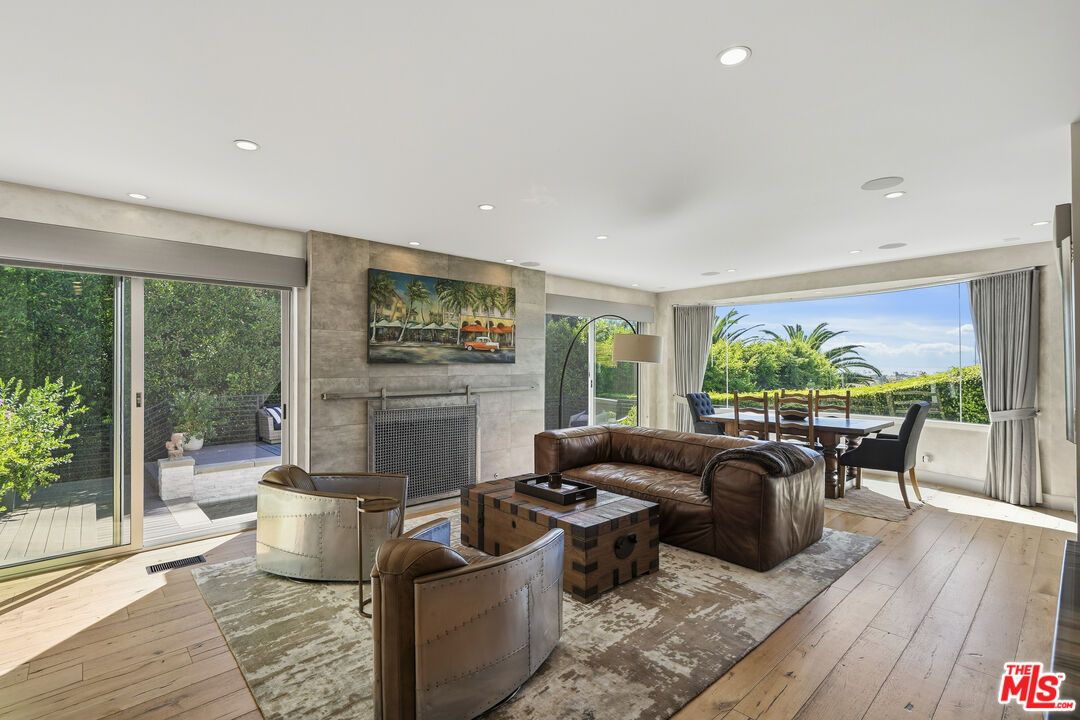 Dining room, Fireplace, Interior, Living room, Recessed Lighting, Wood Texture Flooring