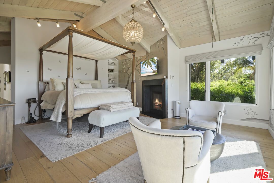 Bedroom, Chandelier, Fireplace, Interior, Pendant Lights, Wooden Ceilings, Wood Texture Flooring