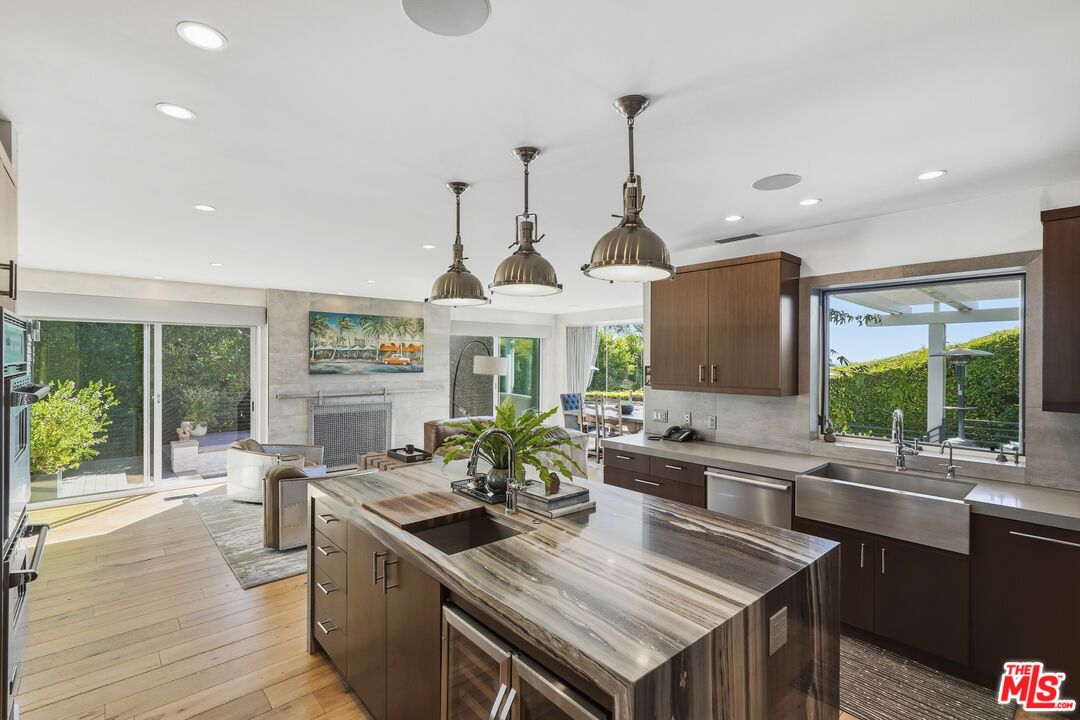 Fireplace, Interior, Kitchen, Pendant Lights, Recessed Lighting, Stainless Steel Appliances, Wood Texture Flooring