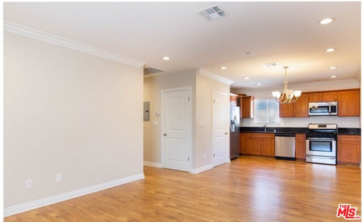 Chandelier, Interior, Kitchen, Recessed Lighting, Stainless Steel Appliances, Wood Texture Flooring
