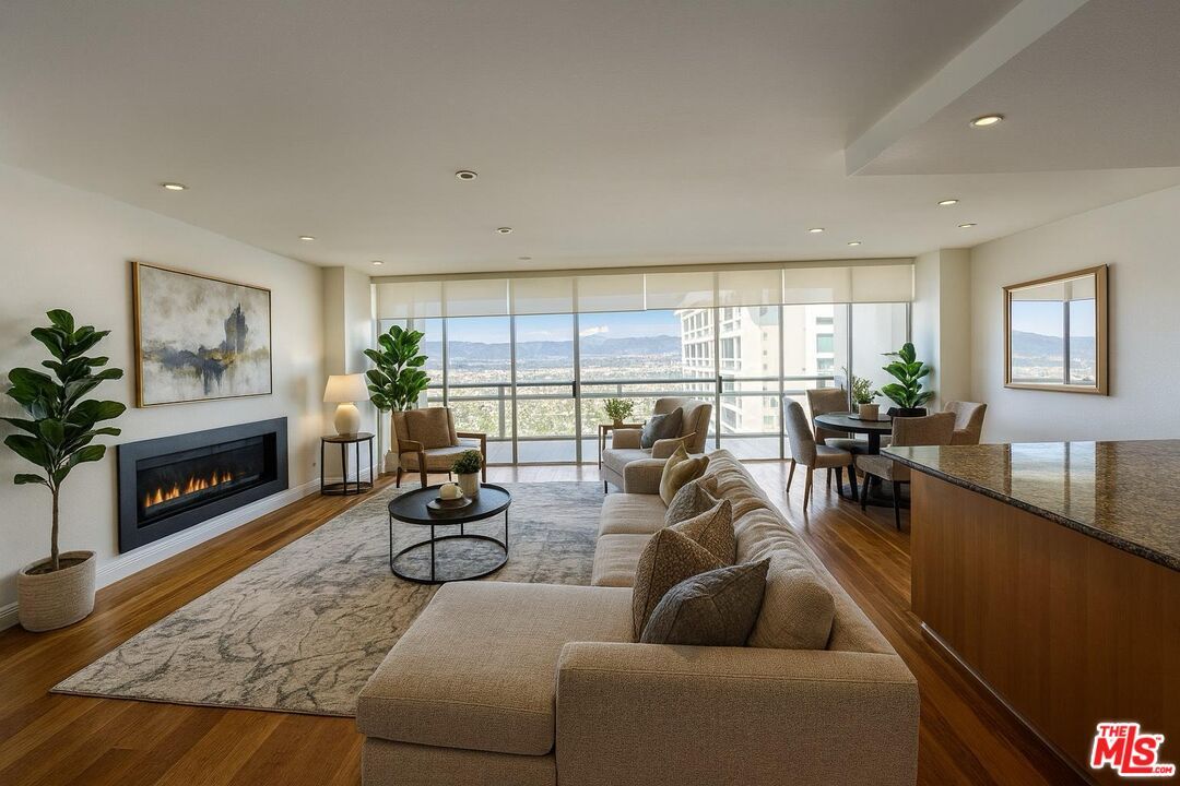 Dining room, Fireplace, Interior, Living room, Recessed Lighting, Wood Texture Flooring