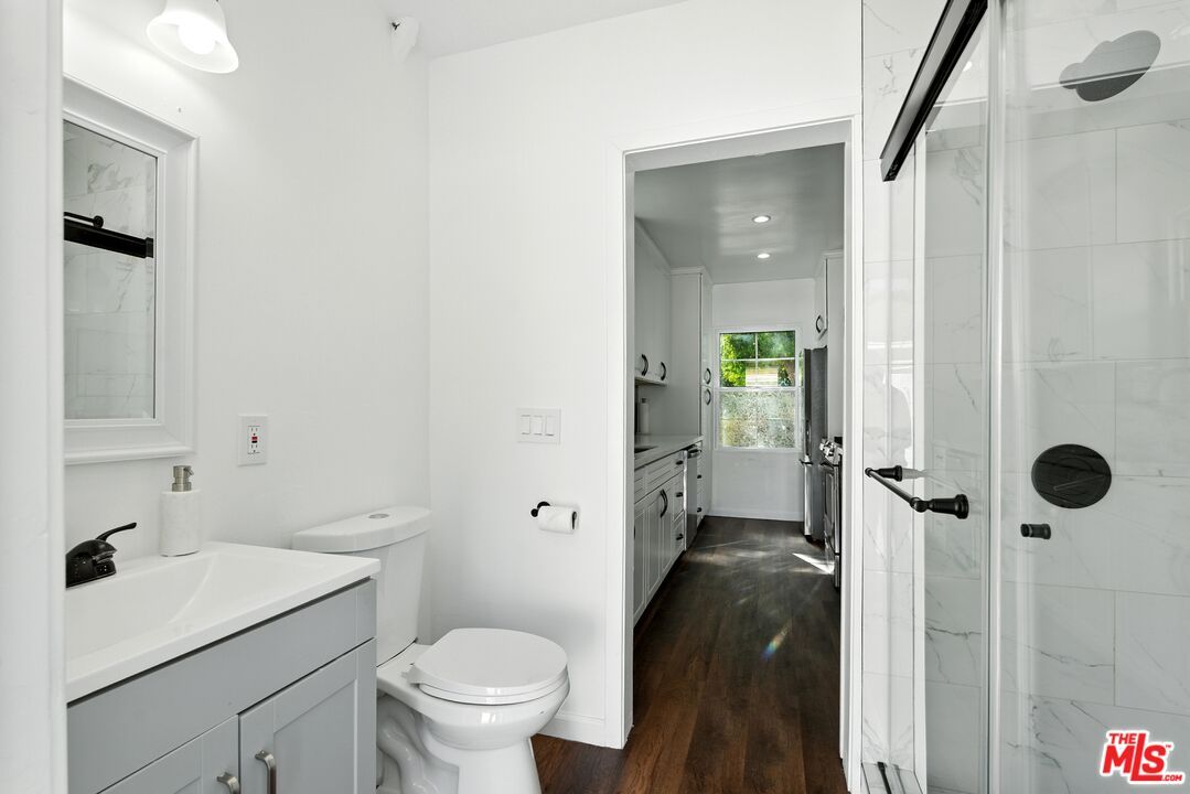 Bathroom, Glass Shower, Interior, Marble Walls, Recessed Lighting, Wood Texture Flooring