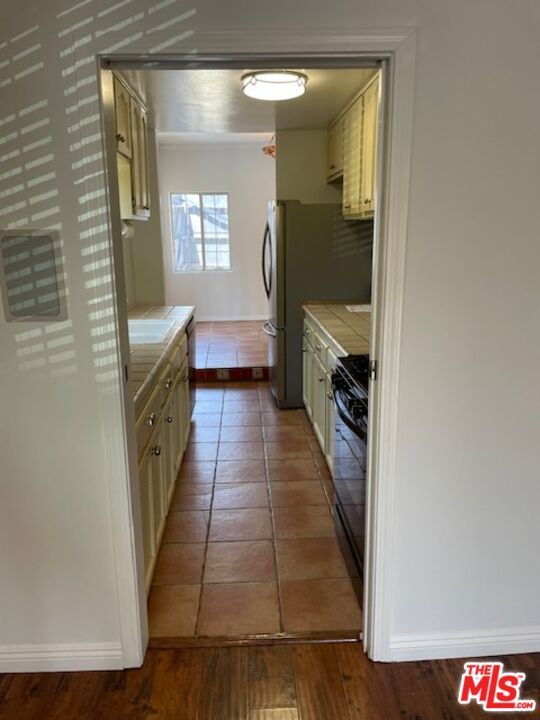 Interior, Kitchen, Tile Countertops, Wood Texture Flooring