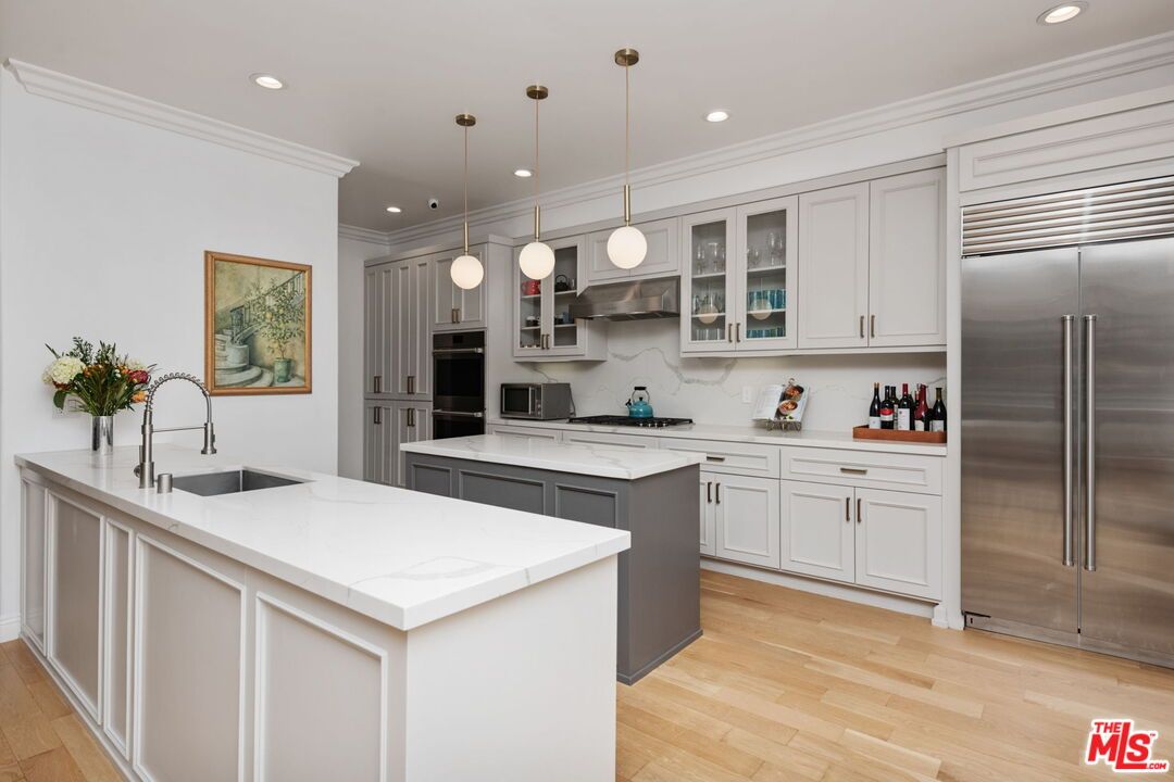 Interior, Kitchen, Marble Walls, Pendant Lights, Recessed Lighting, Stainless Steel Appliances, Wood Texture Flooring