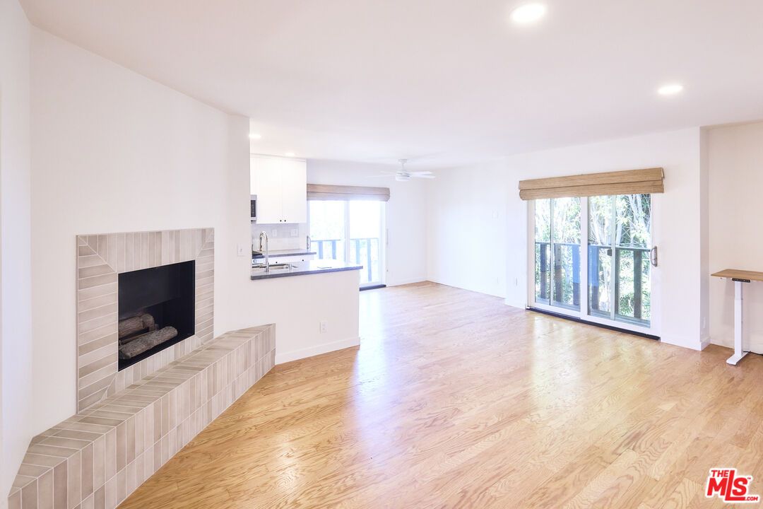 Empty room, Fireplace, Interior, Kitchen, Recessed Lighting, Wood Texture Flooring