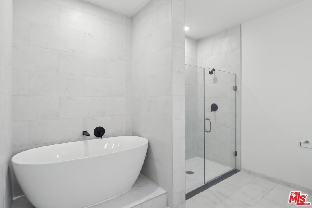 Bathroom, Free Standing Baths, Glass Shower, Interior, Marble Walls, Recessed Lighting