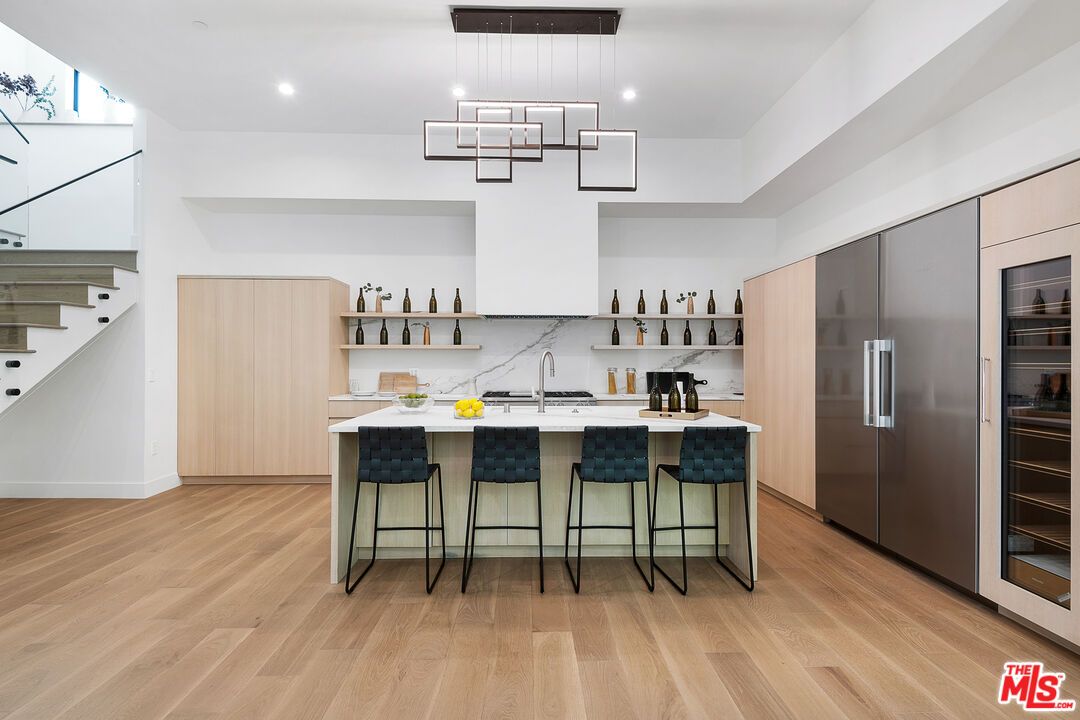 Interior, Kitchen, Marble Walls, Pendant Lights, Recessed Lighting, Stainless Steel Appliances, Wood Texture Flooring