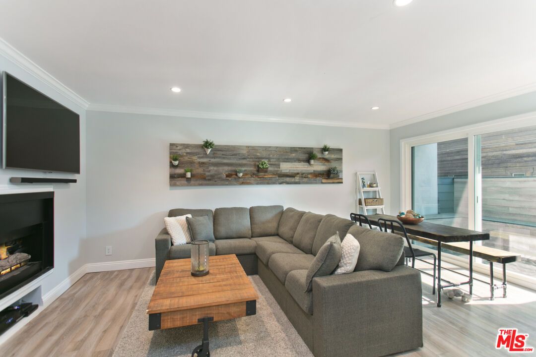 Dining room, Fireplace, Interior, Living room, Recessed Lighting, Wood Texture Flooring