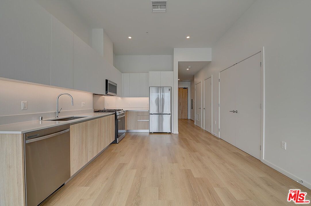 Interior, Kitchen, Recessed Lighting, Stainless Steel Appliances, Wood Texture Flooring