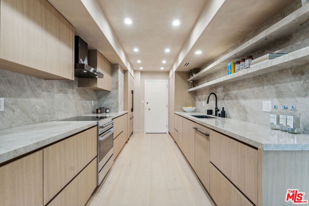 Interior, Kitchen, Marble Walls, Recessed Lighting, Stainless Steel Appliances, Wood Texture Flooring