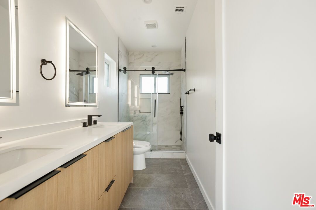 Bathroom, Dual Sink Vanities, Glass Shower, Interior, Marble Walls