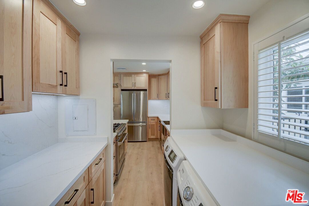 Interior, Kitchen, Recessed Lighting, Washer, Wood Texture Flooring