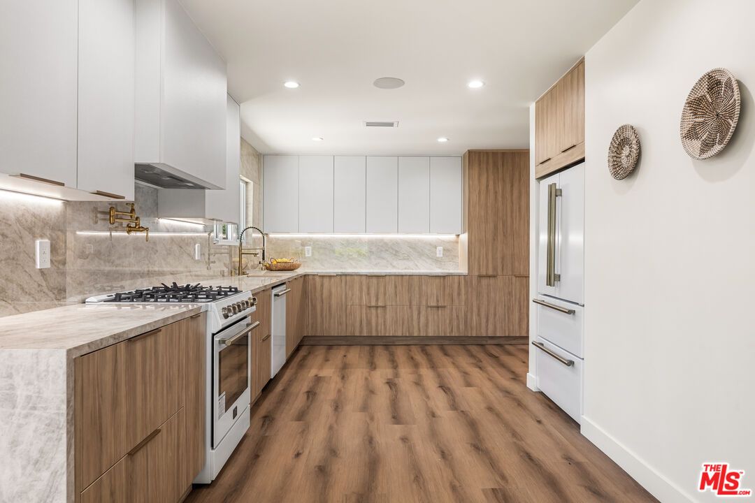 Interior, Kitchen, Marble Walls, Recessed Lighting, Stainless Steel Appliances, Wood Texture Flooring