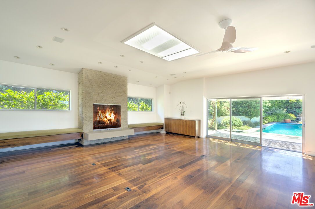 Empty room, Fireplace, Interior, Pool, Recessed Lighting, Wood Texture Flooring