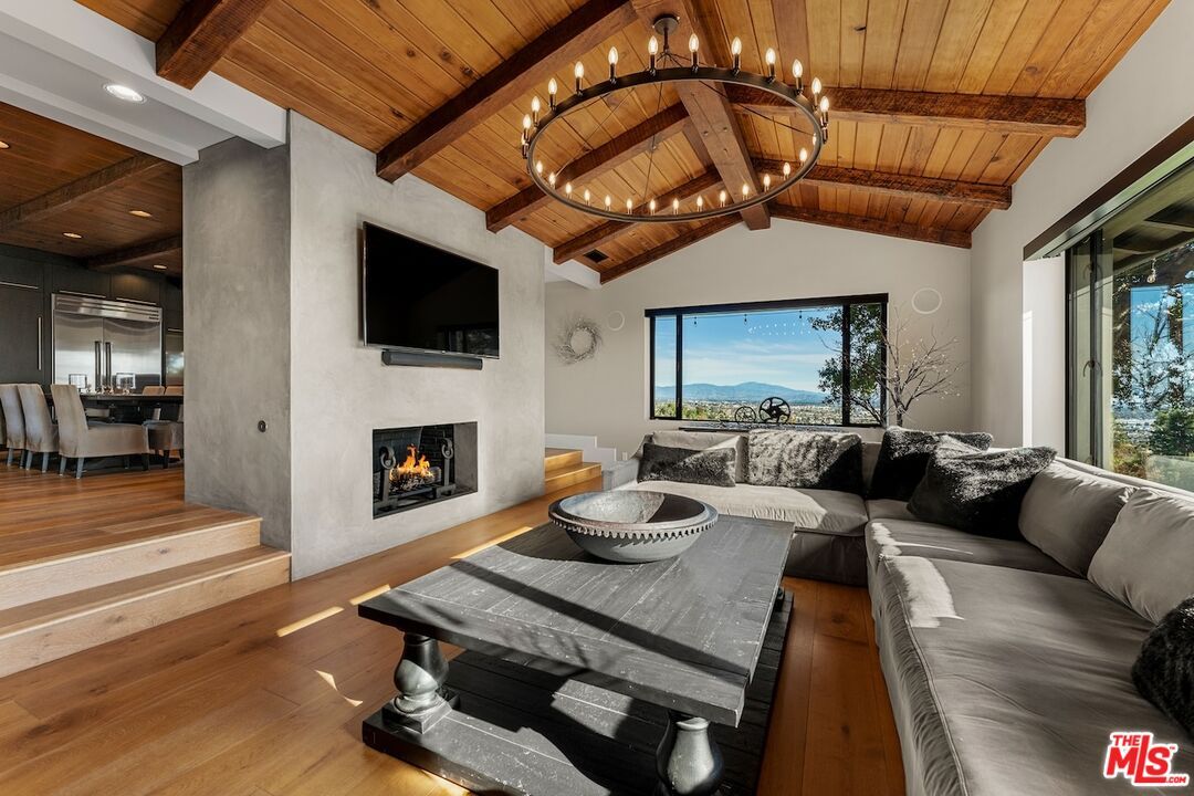 Chandelier, Fireplace, Interior, Living room, Recessed Lighting, Wooden Beams, Wooden Ceilings, Wood Texture Flooring