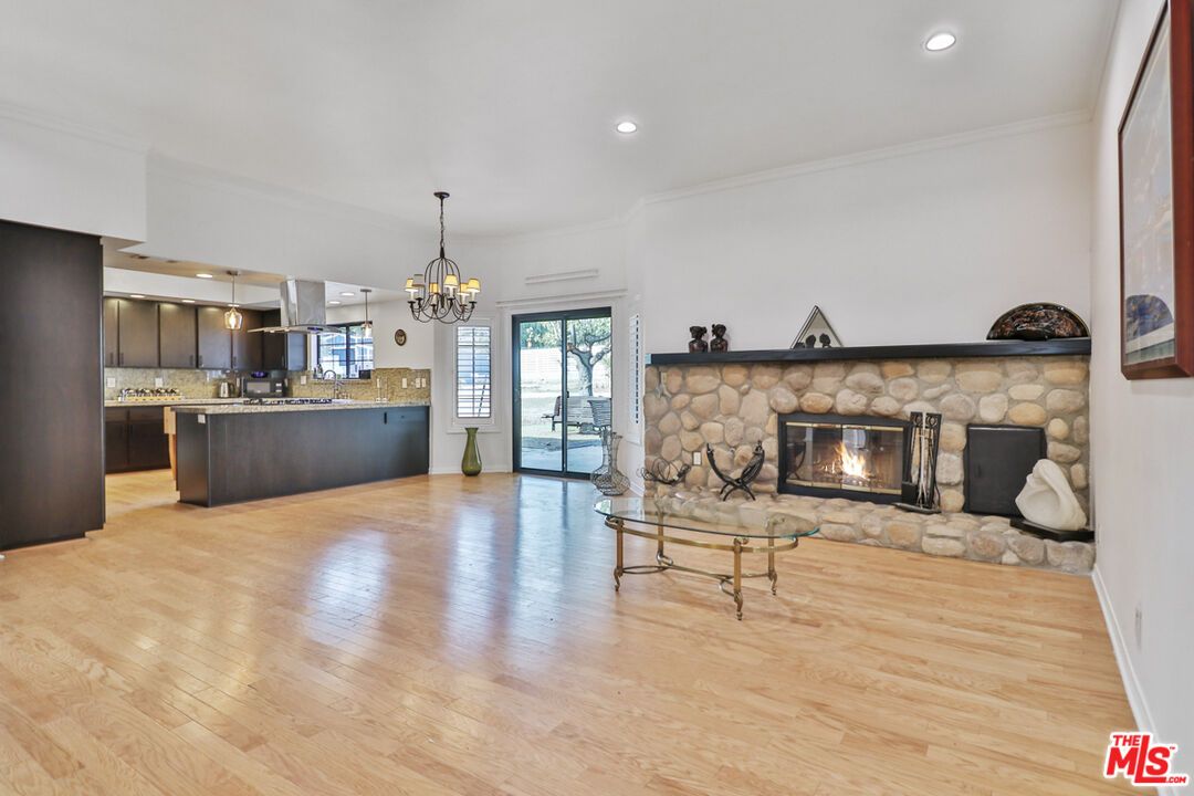 Chandelier, Fireplace, Interior, Kitchen, Pendant Lights, Recessed Lighting, Wood Texture Flooring