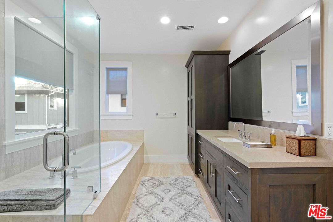 Bathroom, Dual Sink Vanities, Glass Shower, Interior, Recessed Lighting, Wood Texture Flooring