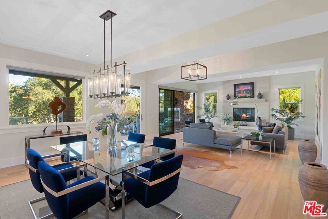 Dining room, Fireplace, Interior, Living room, Pendant Lights, Recessed Lighting, Wood Texture Flooring