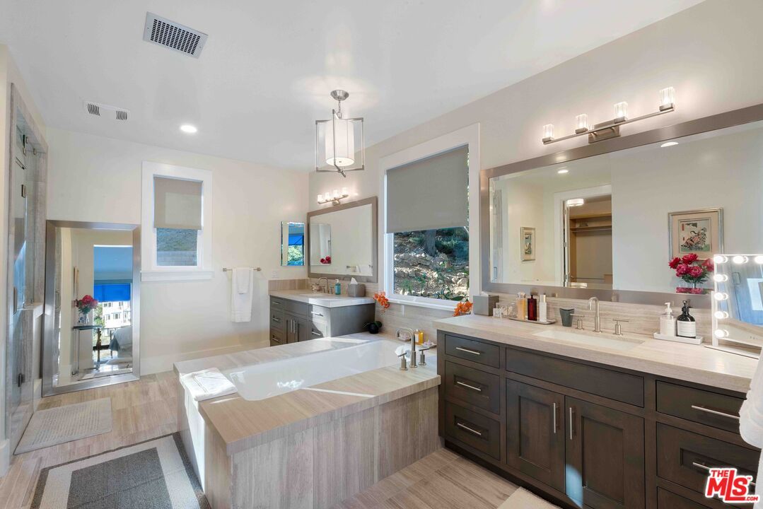 Bathroom, Dual Sink Vanities, Interior, Pendant Lights, Recessed Lighting, Wood Texture Flooring