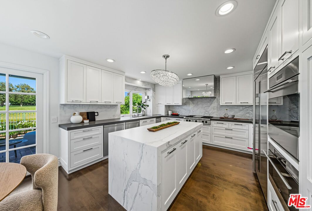 Chandelier, Interior, Kitchen, Marble Walls, Recessed Lighting, Stainless Steel Appliances, Wood Texture Flooring