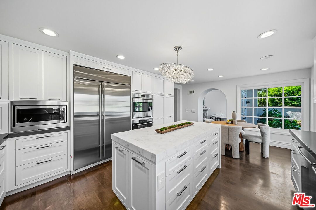 Chandelier, Dining room, Interior, Kitchen, Recessed Lighting, Stainless Steel Appliances, Wood Texture Flooring