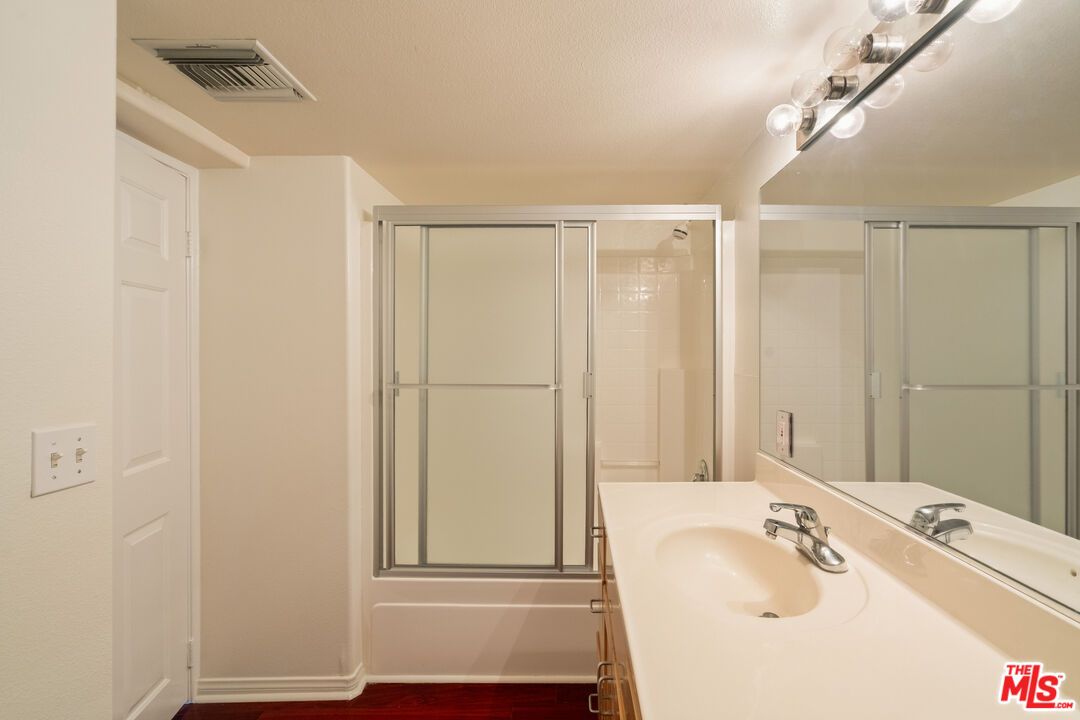 Bathroom, Dual Sink Vanities, Glass Shower, Interior, Wood Texture Flooring