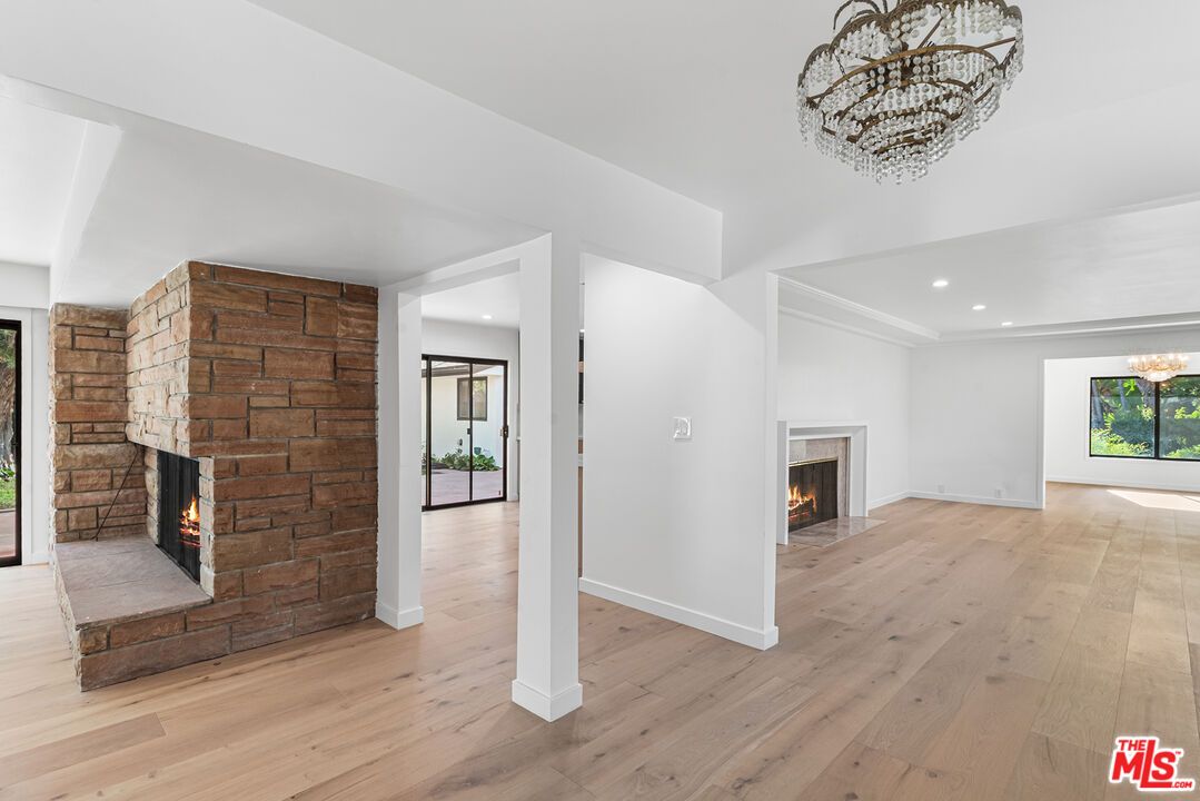 Empty room, Fireplace, Interior, Recessed Lighting, Stone Walls, Wood Texture Flooring