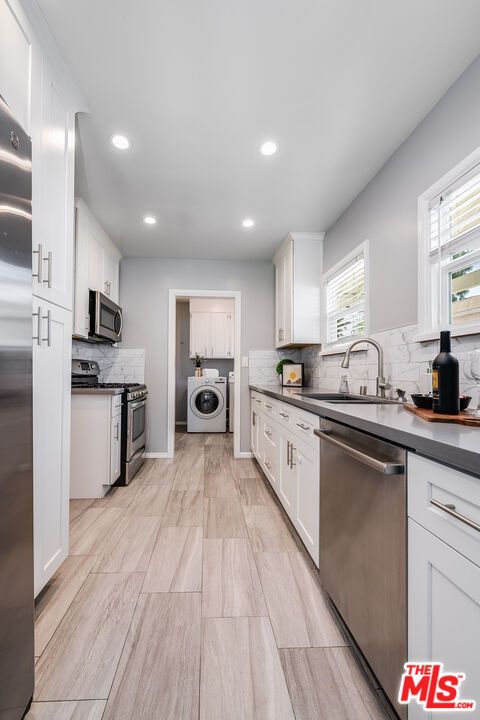 Interior, Kitchen, Recessed Lighting, Stainless Steel Appliances, Washer, Wood Texture Flooring