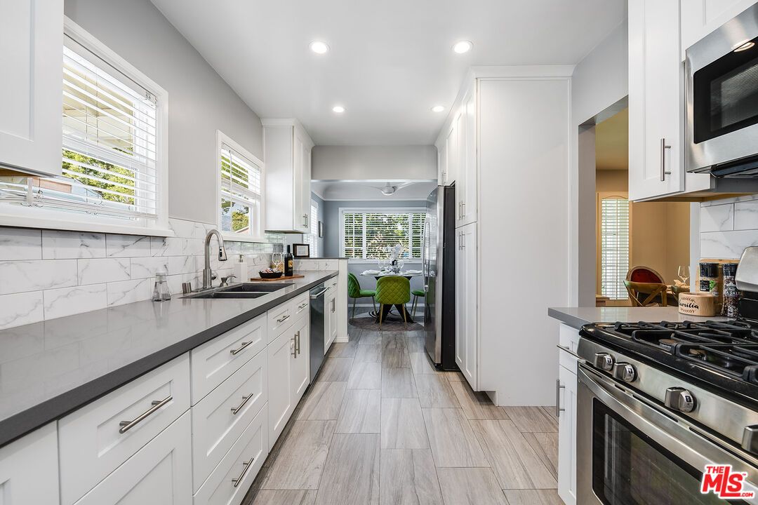 Dining room, Interior, Kitchen, Marble Walls, Recessed Lighting, Stainless Steel Appliances, Wood Texture Flooring