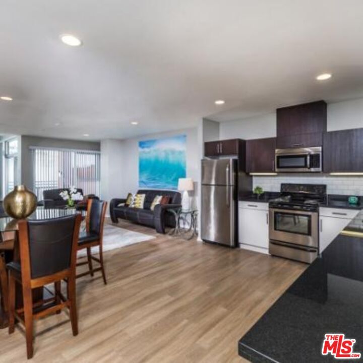 Dining room, Interior, Kitchen, Living room, Recessed Lighting, Stainless Steel Appliances, Wood Texture Flooring