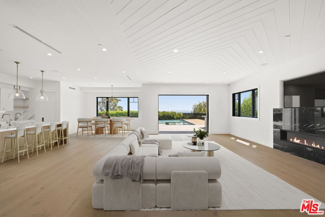 Dining room, Fireplace, Interior, Living room, Pendant Lights, Recessed Lighting, Wood Texture Flooring