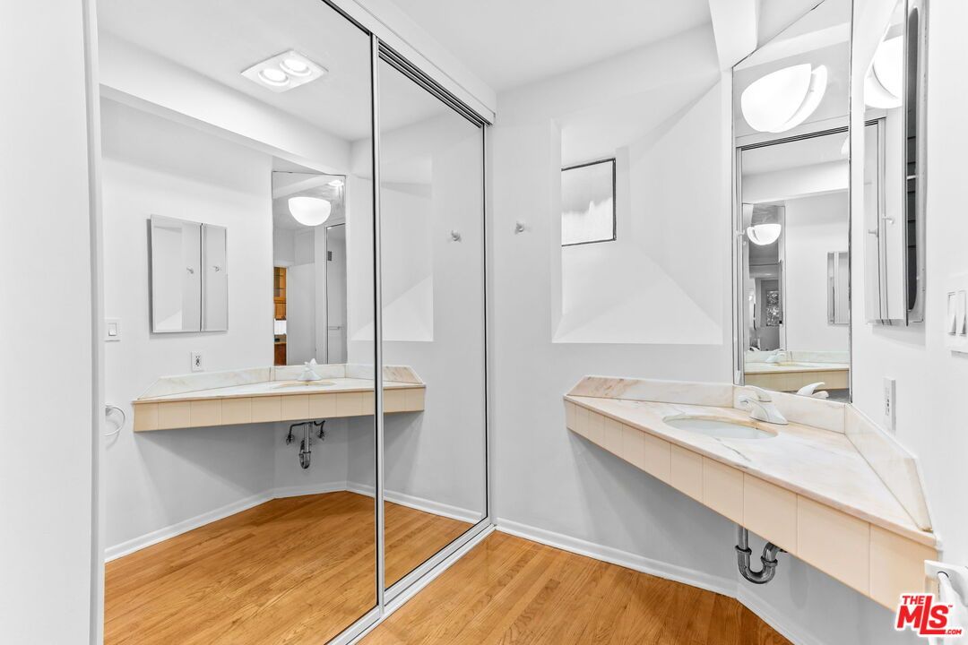 Bathroom, Dual Sink Vanities, Glass Shower, Interior, Recessed Lighting, Tile Countertops, Wood Texture Flooring