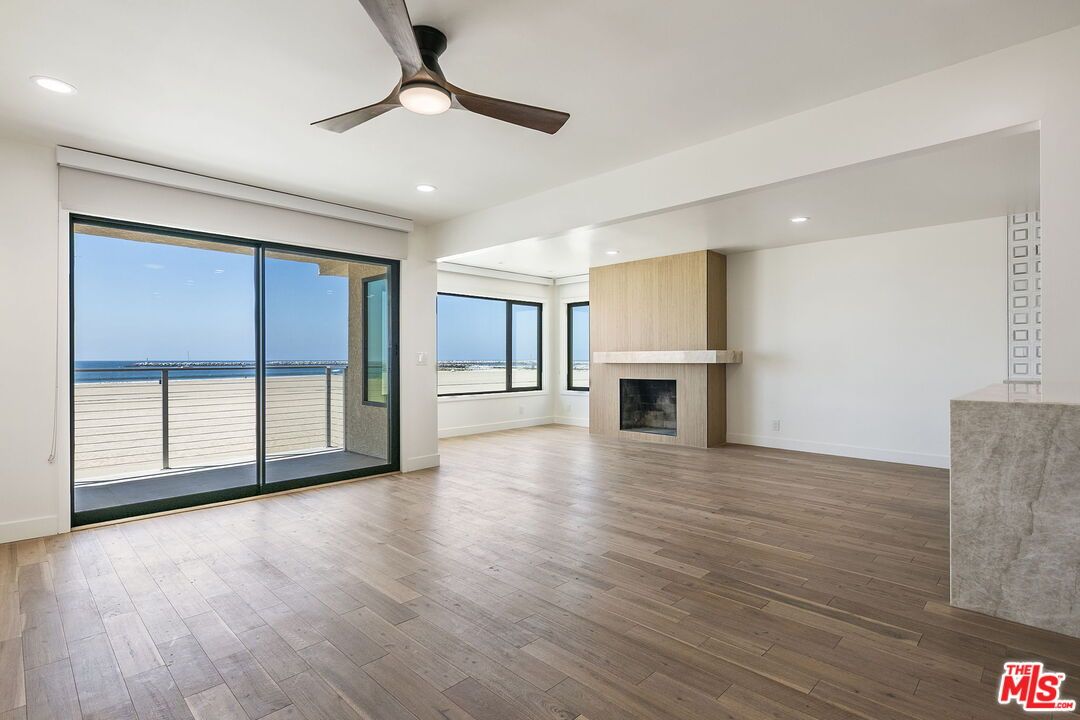 Empty room, Fireplace, Interior, Recessed Lighting, Water, Wood Texture Flooring