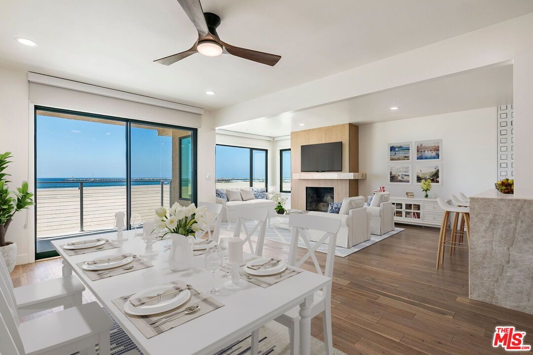 Dining room, Fireplace, Interior, Living room, Recessed Lighting, Water, Wood Texture Flooring