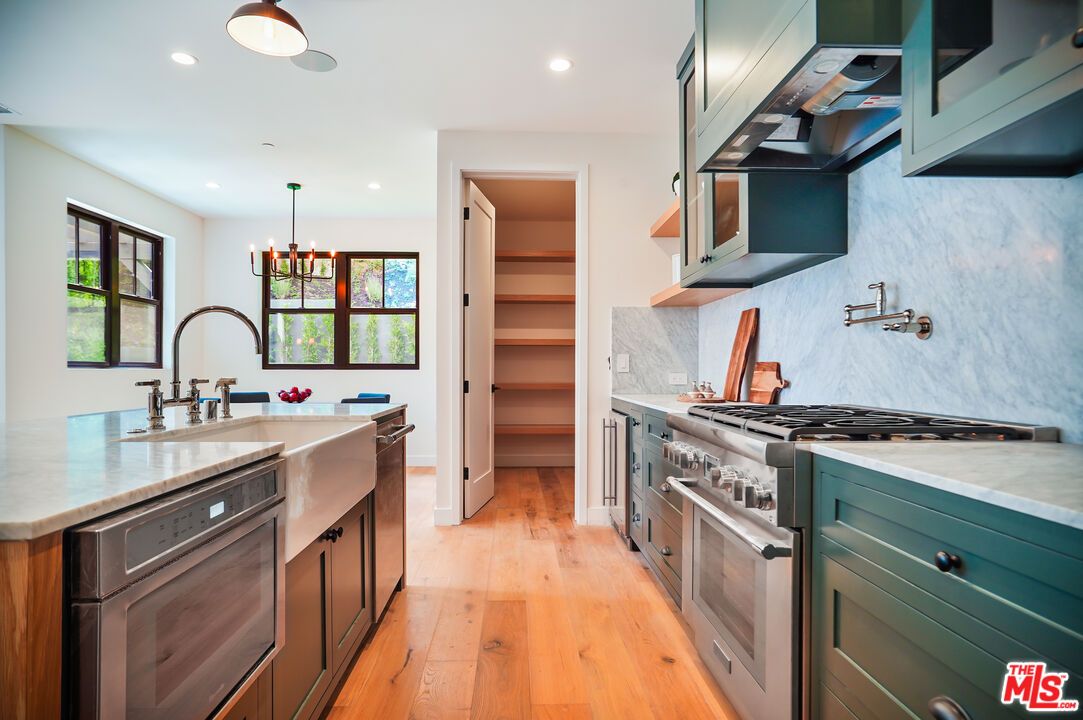Chandelier, Interior, Kitchen, Pendant Lights, Recessed Lighting, Stainless Steel Appliances, Wood Texture Flooring