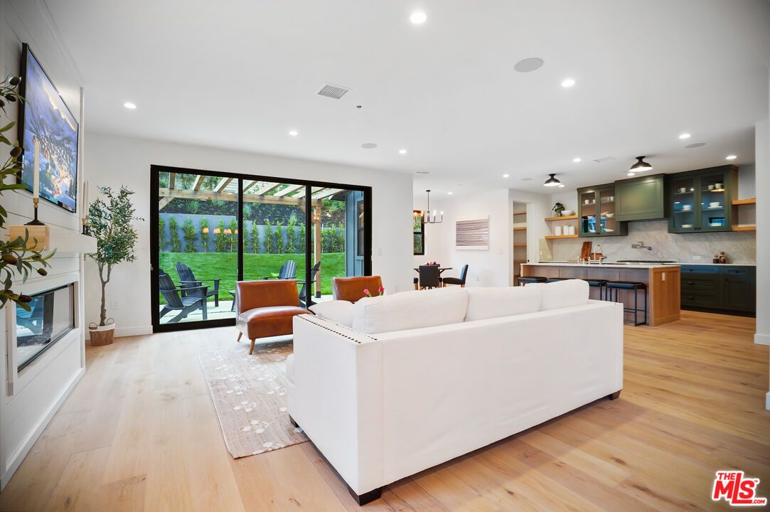 Dining room, Fireplace, Interior, Kitchen, Living room, Pendant Lights, Recessed Lighting, Wood Texture Flooring