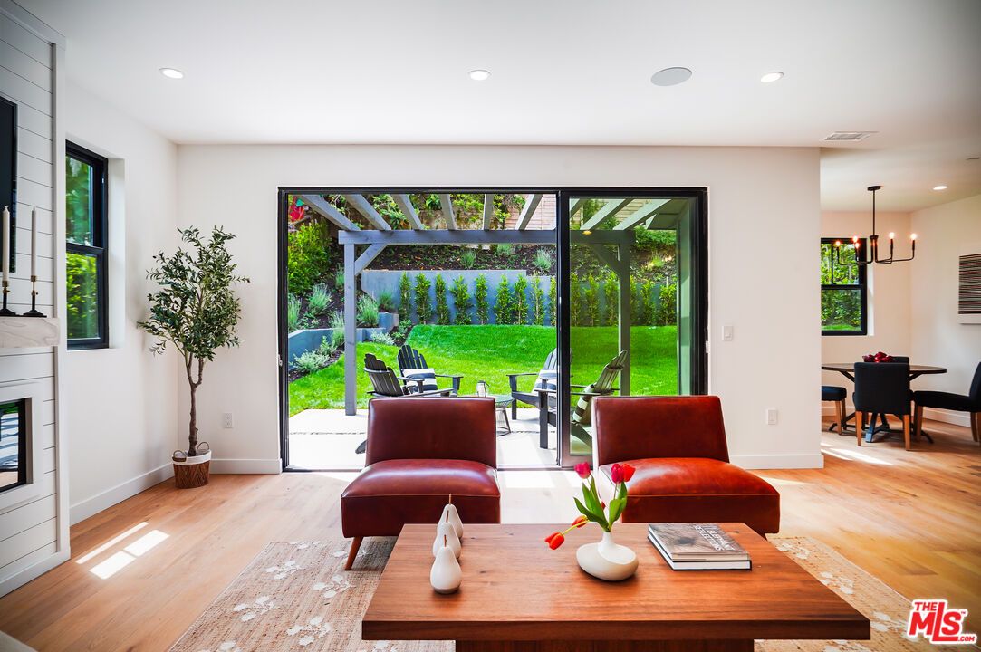Dining room, Fireplace, Interior, Living room, Pendant Lights, Recessed Lighting, Wood Texture Flooring