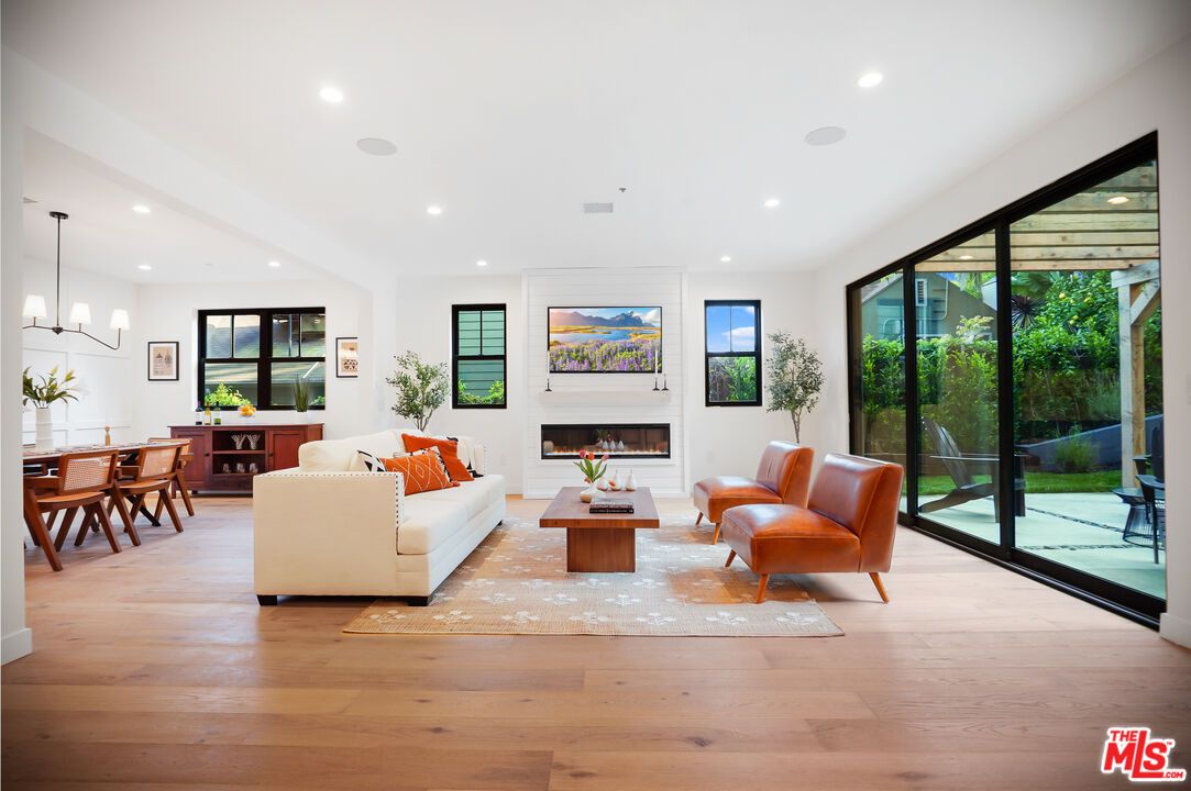 Dining room, Fireplace, Interior, Living room, Pendant Lights, Recessed Lighting, Wood Texture Flooring