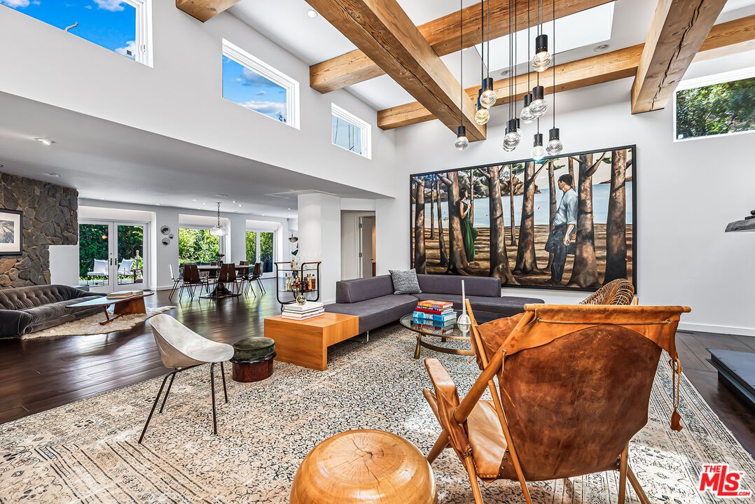 Dining room, Fireplace, Interior, Living room, Pendant Lights, Recessed Lighting, Stone Walls, Wooden Beams, Wood Texture Flooring