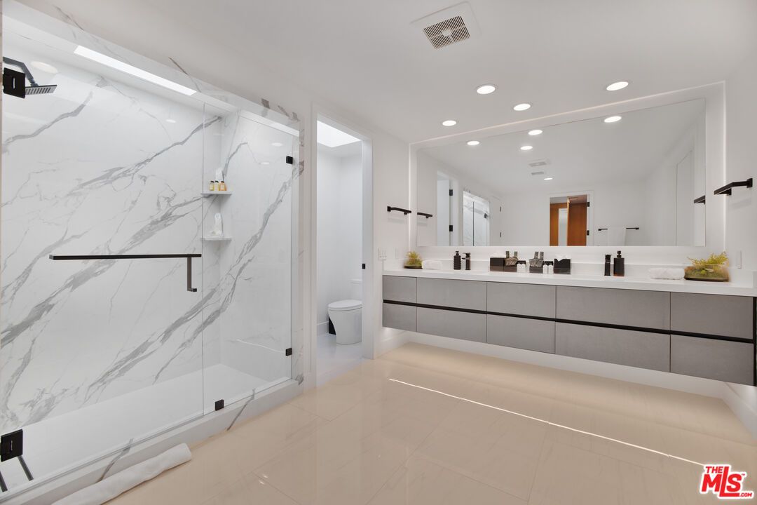 Bathroom, Dual Sink Vanities, Glass Shower, Interior, Marble Walls, Recessed Lighting