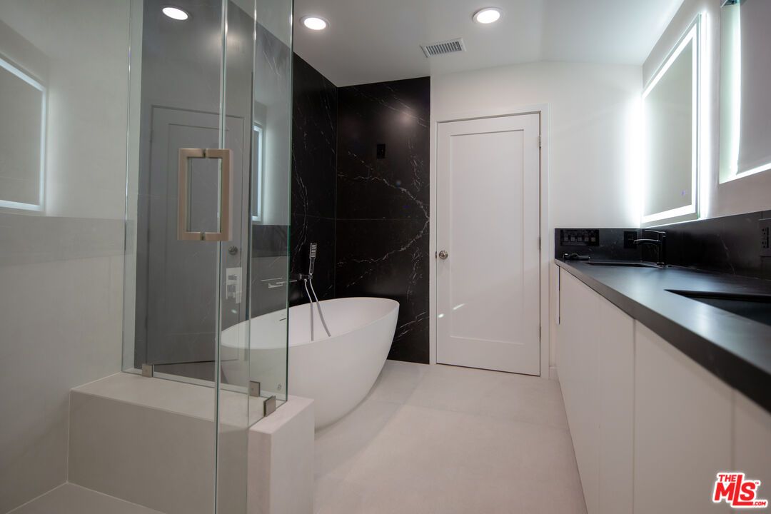 Bathroom, Free Standing Baths, Glass Shower, Interior, Marble Walls, Recessed Lighting