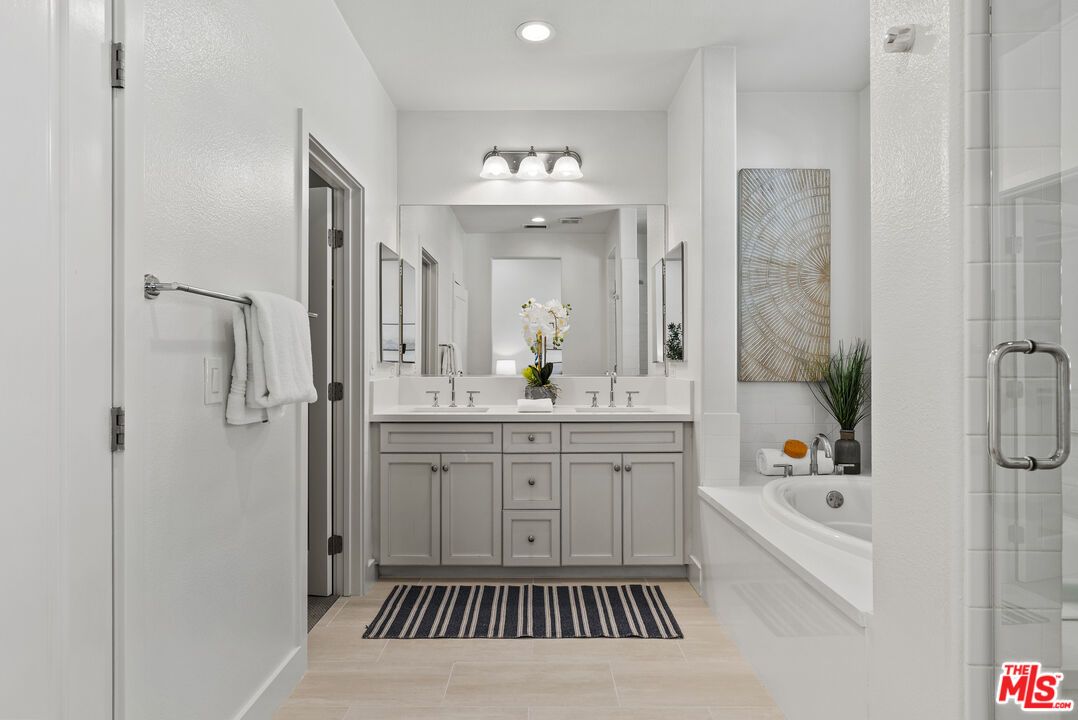 Bathroom, Dual Sink Vanities, Glass Shower, Interior, Recessed Lighting, Wood Texture Flooring