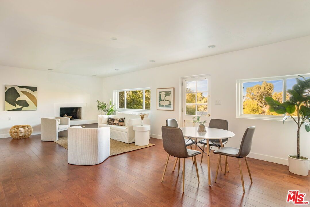Dining room, Fireplace, Interior, Living room, Recessed Lighting, Wood Texture Flooring