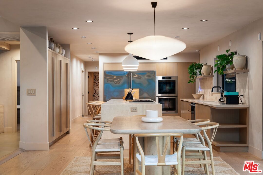 Dining room, Interior, Kitchen, Pendant Lights, Recessed Lighting, Stainless Steel Appliances, Wood Texture Flooring